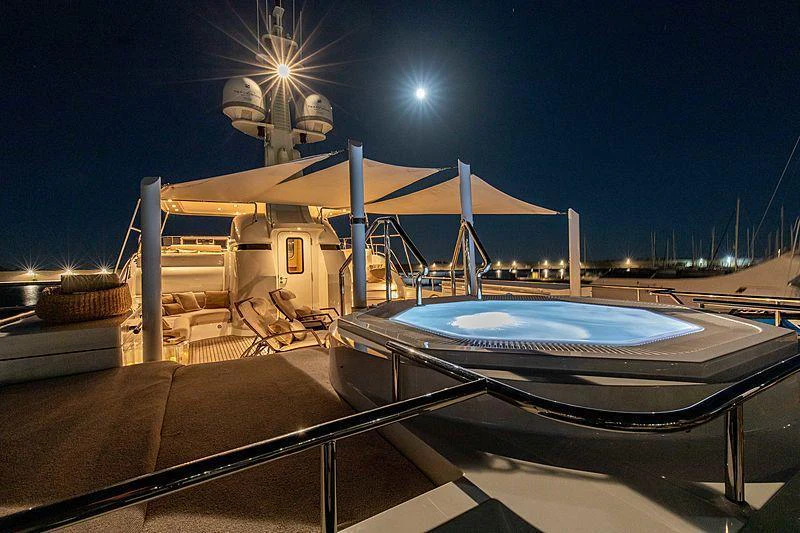 a pool with a building in the background aboard GALENA Yacht for Charter