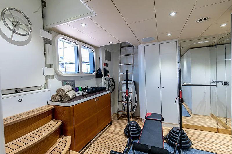 a room with a bed and a desk aboard GALENA Yacht for Charter