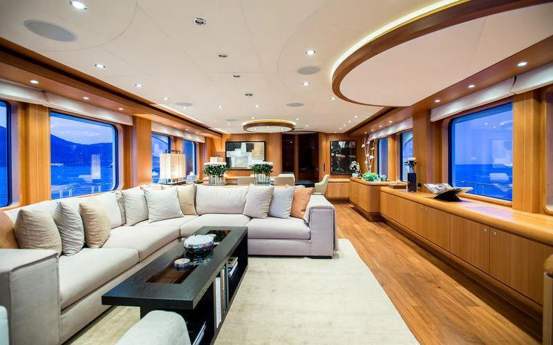 a living room with a couch and a table aboard GALENA Yacht for Charter