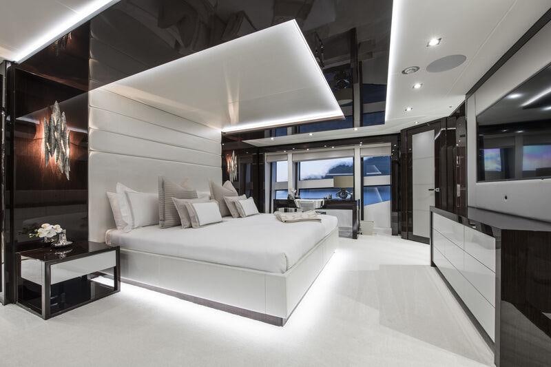 a room with a couch and a table aboard BERCO VOYAGER Yacht for Charter