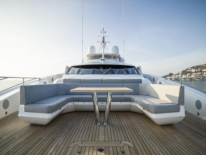 a white yacht on a deck aboard BERCO VOYAGER Yacht for Charter