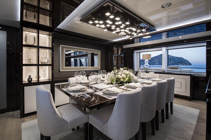 a dining room with a large table aboard BERCO VOYAGER Yacht for Charter