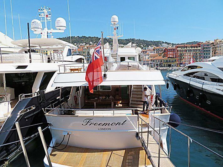 a boat with a flag on it aboard FREEMONT Yacht for Charter