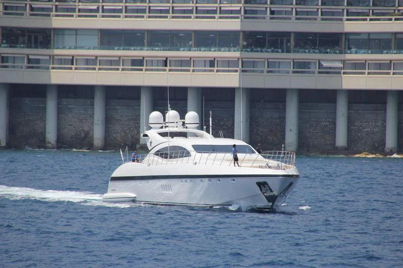 a white boat on the water aboard BO Yacht for Charter