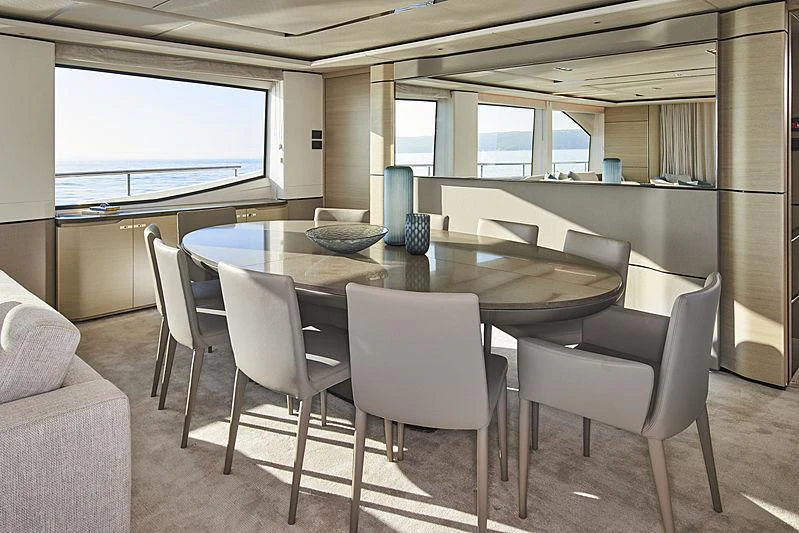 a table with chairs around it aboard HALLELUJAH Yacht for Charter