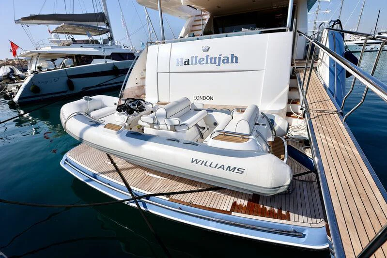 a boat docked at a pier aboard HALLELUJAH Yacht for Charter