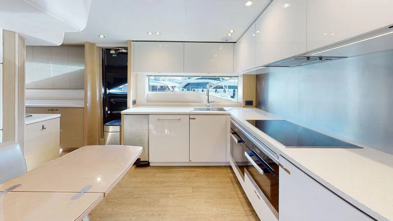 a kitchen with white cabinets aboard HALLELUJAH Yacht for Charter