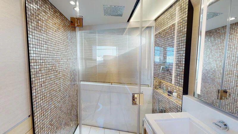 a bathroom with a glass shower aboard HALLELUJAH Yacht for Charter