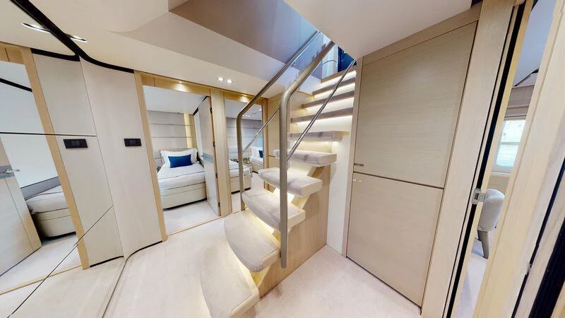a room with a bed and a closet aboard HALLELUJAH Yacht for Charter