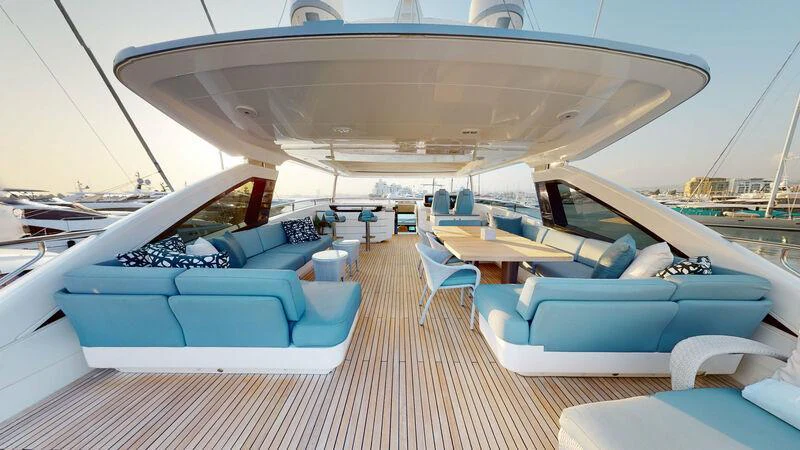 a large lounge area with a lounge chair and a large white tent aboard HALLELUJAH Yacht for Charter