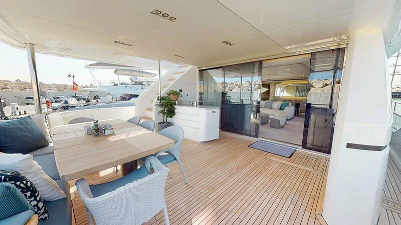 a room with a table and chairs aboard HALLELUJAH Yacht for Charter