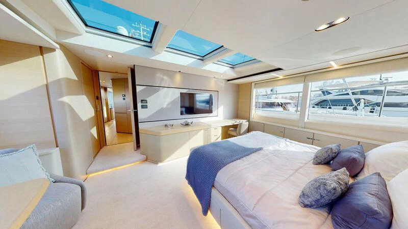 a room with a couch and a tv aboard HALLELUJAH Yacht for Charter