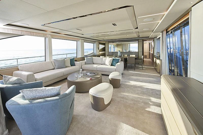 a living room with a large window aboard HALLELUJAH Yacht for Charter