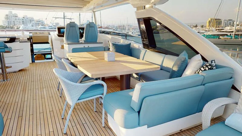 a room with a table and chairs aboard HALLELUJAH Yacht for Charter
