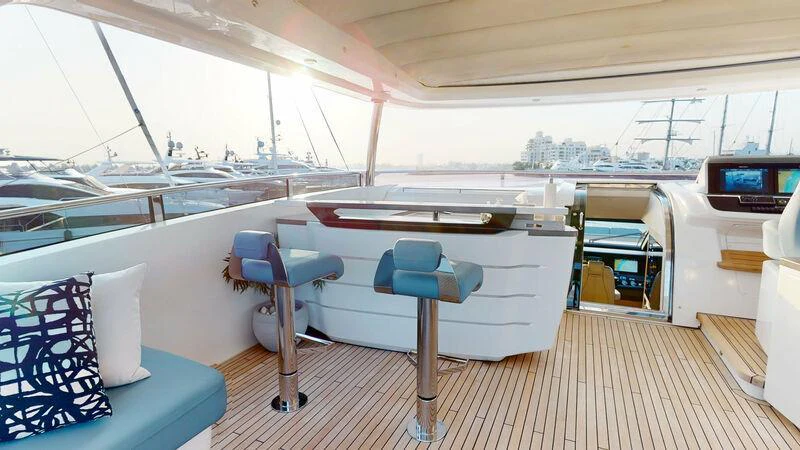 a boat with a table and chairs aboard HALLELUJAH Yacht for Charter