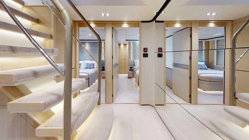 a room with a white floor and a white wall with glass doors aboard HALLELUJAH Yacht for Charter