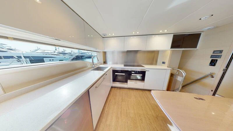 a kitchen with a large window aboard HALLELUJAH Yacht for Charter