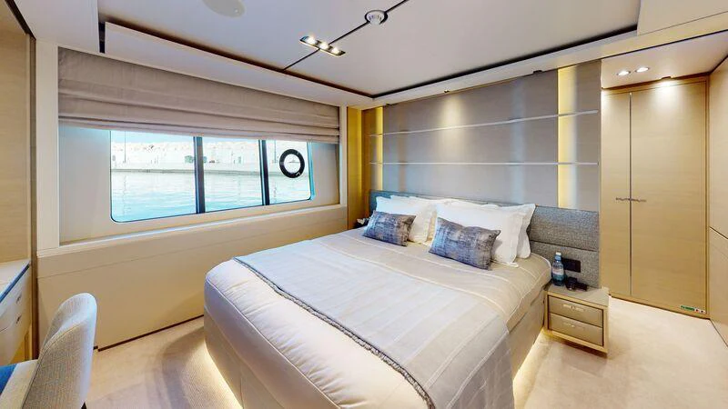 a bedroom with a bed and a couch aboard HALLELUJAH Yacht for Charter