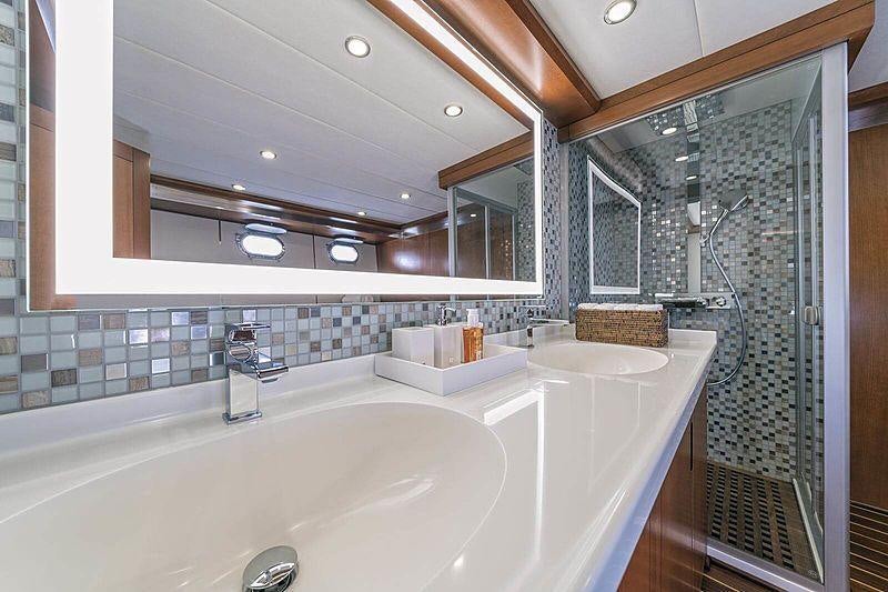 a bathroom with a tub and sink aboard SAN LIMI Yacht for Charter
