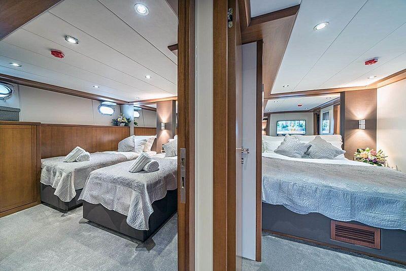 a couple of beds in a room aboard SAN LIMI Yacht for Charter