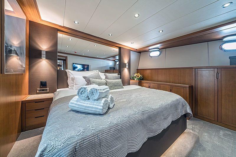 a bed in a room aboard SAN LIMI Yacht for Charter