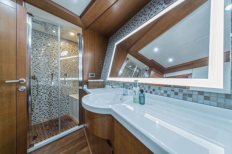 a bathroom with a large bathtub aboard SAN LIMI Yacht for Charter