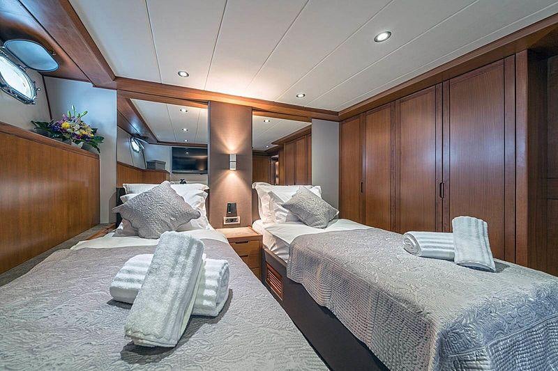 a room with wooden cabinets aboard SAN LIMI Yacht for Charter