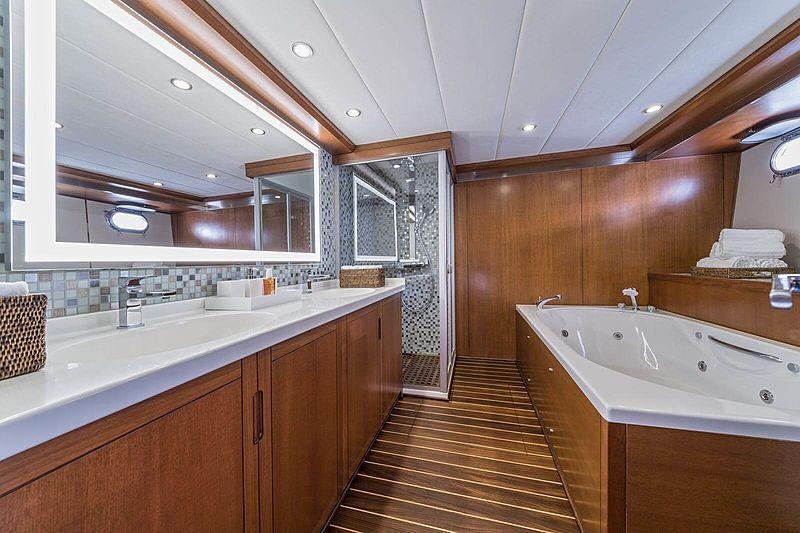 a bathroom with a wood floor aboard SAN LIMI Yacht for Charter