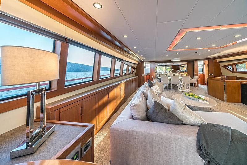 a living room with a couch and a tv aboard SAN LIMI Yacht for Charter