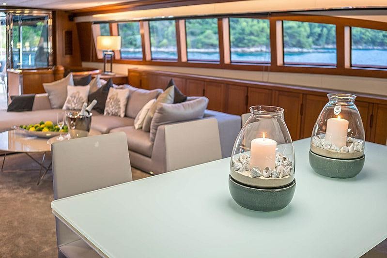 a living room with a large glass bowl on a table aboard SAN LIMI Yacht for Charter