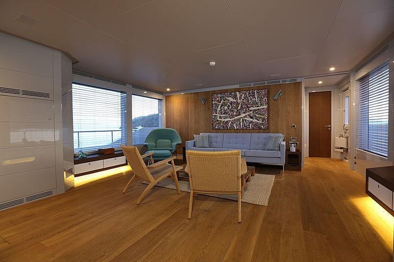 a living room with a couch and a table aboard ONLY NOW Yacht for Charter