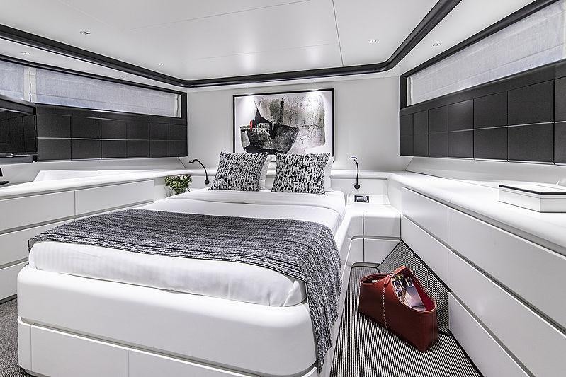 a room with a couple of beds aboard PROJECT STEEL Yacht for Charter