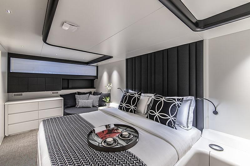 a living room with a black and white rug aboard PROJECT STEEL Yacht for Charter