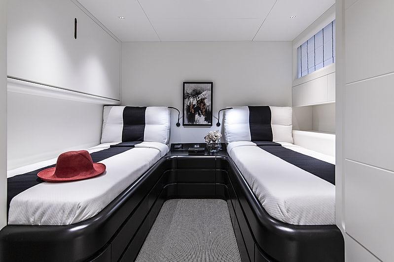 a room with two beds aboard PROJECT STEEL Yacht for Charter