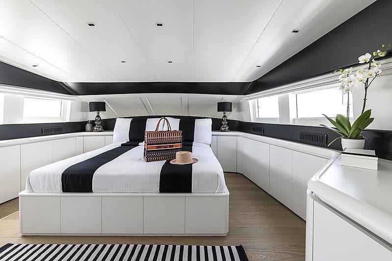 a white bed in a room aboard PROJECT STEEL Yacht for Charter