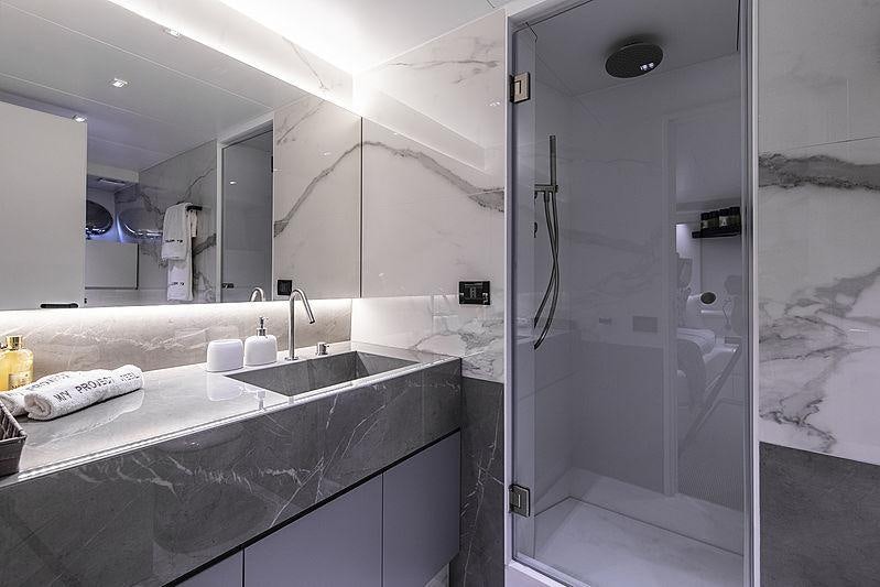 a bathroom with a large mirror aboard PROJECT STEEL Yacht for Charter