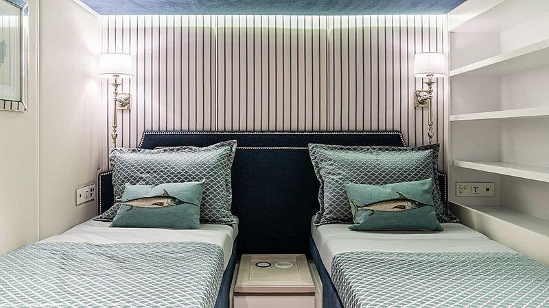 a room with two beds aboard BUNDALONG Yacht for Charter