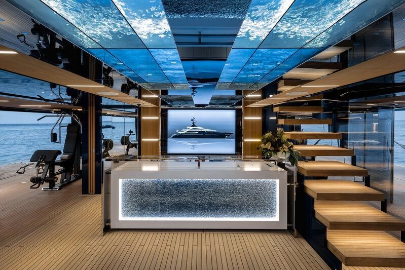 a room with a large screen aboard RESILIENCE Yacht for Charter