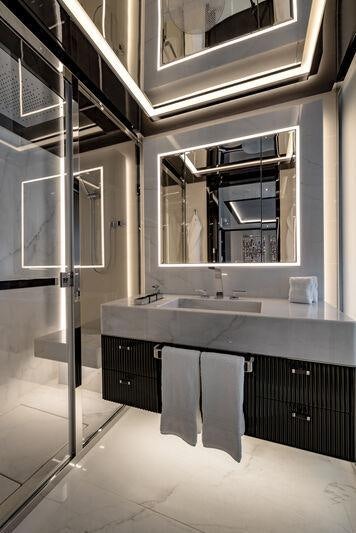 a bathroom with a sink and a mirror aboard RESILIENCE Yacht for Charter