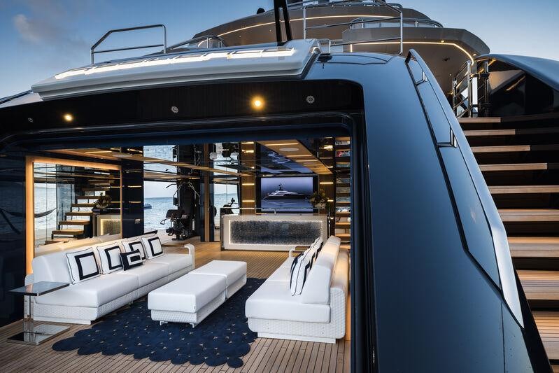a large black and white boat on a deck aboard RESILIENCE Yacht for Charter