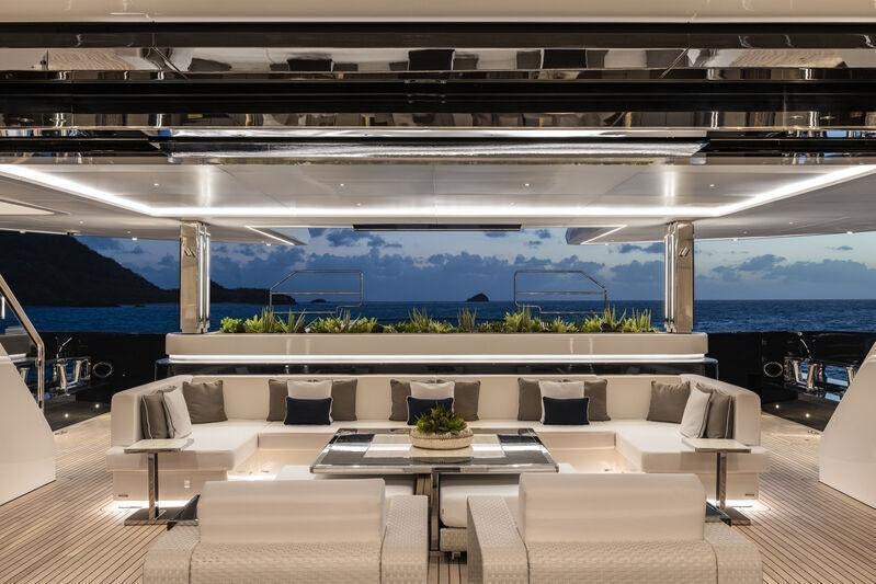 a room with a couch and a table aboard RESILIENCE Yacht for Charter