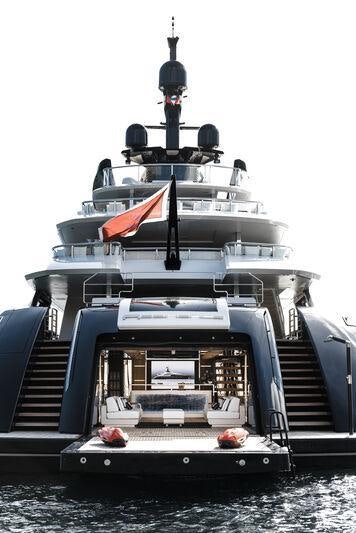 a boat with a flag on the front aboard RESILIENCE Yacht for Charter