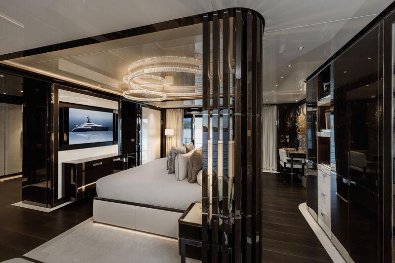 a room with a couch and a tv aboard RESILIENCE Yacht for Charter