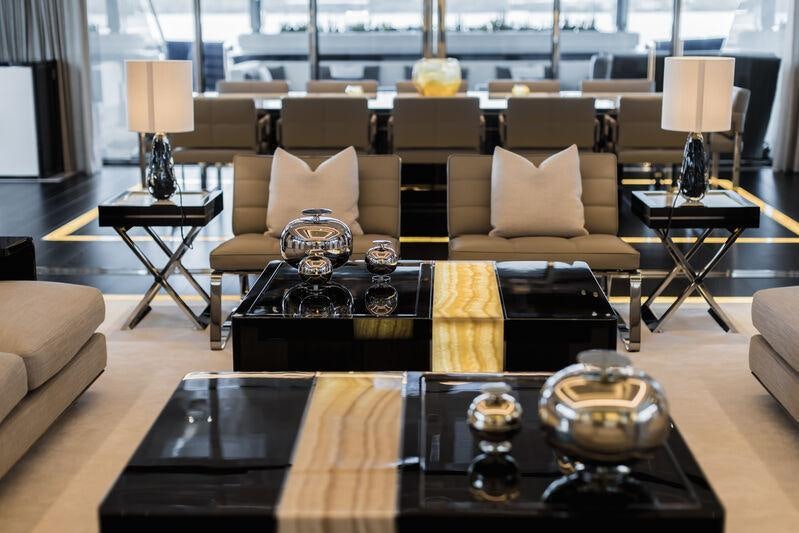 a living room with a large window aboard RESILIENCE Yacht for Charter