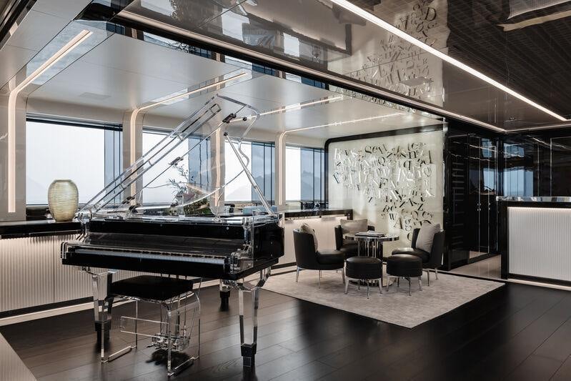 a piano in a room aboard RESILIENCE Yacht for Charter