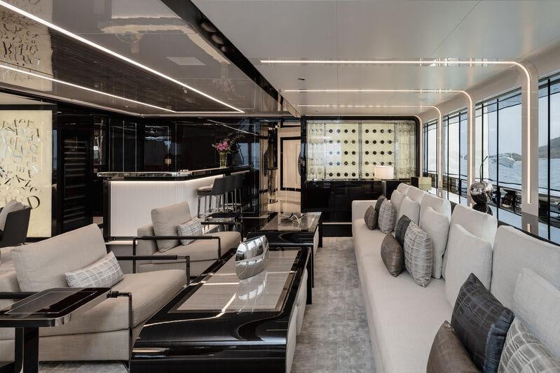 a living room with couches and a table aboard RESILIENCE Yacht for Charter