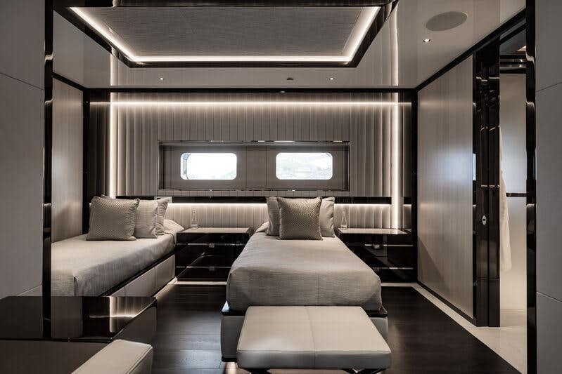 a room with a couch and a tv aboard RESILIENCE Yacht for Charter