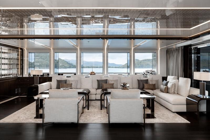 a large living room with a large window aboard RESILIENCE Yacht for Charter