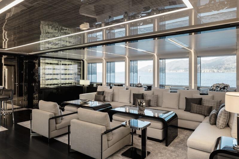 a living room with a large window aboard RESILIENCE Yacht for Charter