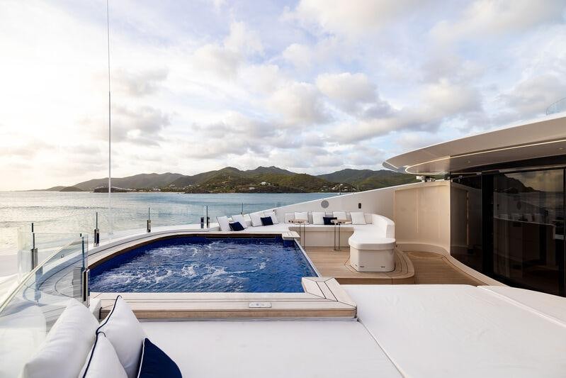 a large swimming pool aboard RESILIENCE Yacht for Charter